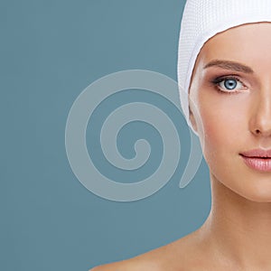 Attractive face of beautiful girl. Close-up portrait of healthy woman. Skin care, cosmetics, makeup, complexion and face