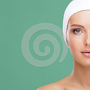 Attractive face of beautiful girl. Close-up portrait of healthy woman. Skin care, cosmetics, makeup, complexion and face