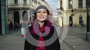 Attractive fashionable young woman walking in a beautiful street. Portrait of elegant asian girl wearing stylish black