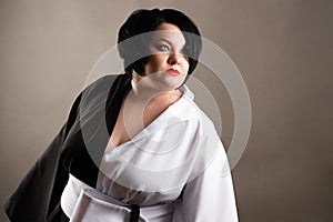 Attractive fat woman in black and white dress