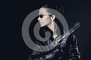 Attractive female agent with raised gun