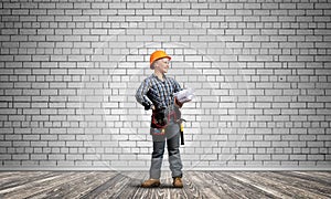 Attractive female architect in hardhat