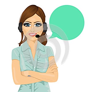 Attractive female customer support phone operator with arms folded and speech bubble