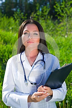 Attractive female doctor outdoors