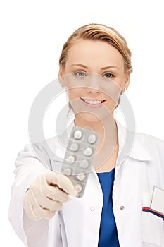 Attractive female doctor with pills