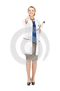 Attractive female doctor pointing her finger