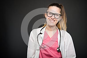 Attractive female doctor portrait smiling wearing glasses