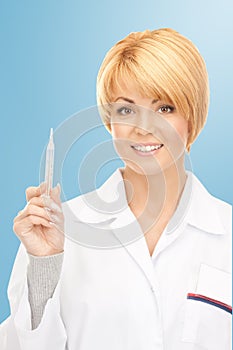 Attractive female doctor with thermometer