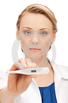 Attractive female doctor with thermometer