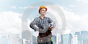 Attractive female engineer in hardhat