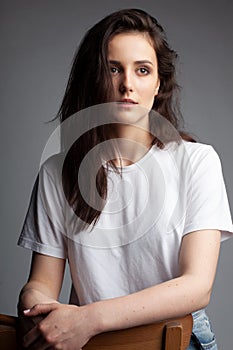 Attractive female model four thirds view in blank white t-shirt