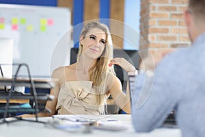 Attractive female sitting on boss seat, control big corporation, female company leader