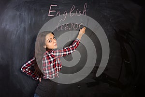 Attractive female teacher giving an English lesson