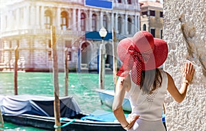 Attractive female tourist at the Canal Grande in Venice, Italy photo