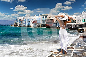 Attractive female tourist in famous Little Venice on Mykonos island, Greece