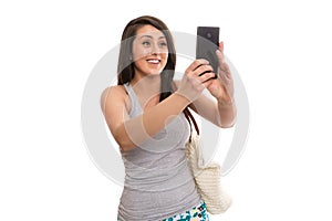 Attractive female tourist taking selfie