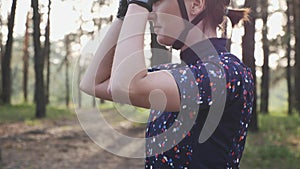 Attractive fit girl tightens road shoes and puts on cycling glasses before training race. Cycling concept