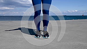 Attractive, fit, young woman jumping rope in slow motion, stock footage by Brian Holm Nielsen