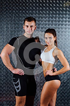 Attractive fitness couple indoor portrait.