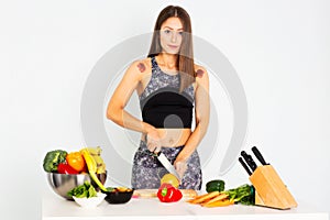 Attractive fitness woman, trained female Fit power athletic confident young woman bodybuilder cuting orange, Organic Food.