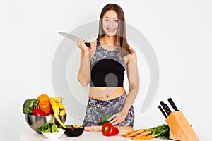 Attractive fitness woman, trained female Fit power athletic confident young woman bodybuilder doing exercises , Organic Food.