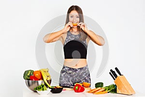 Attractive fitness woman, trained female Fit power athletic confident young woman bodybuilder eating orange, Organic Food.