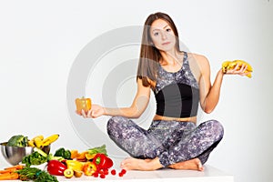 Attractive fitness woman, trained female Fit power athletic confident young woman bodybuilder with veg , Organic Food.