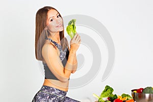 Attractive fitness woman, trained female Fit power athletic confident young woman bodybuilder with veg , Organic Food.
