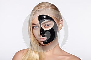 Attractive girl with a black mask on the face