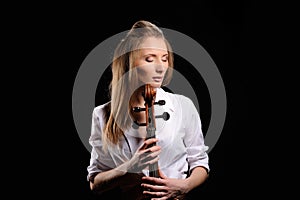 attractive girl with cello isolated over black background