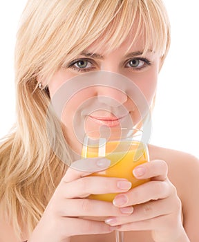 Attractive girl drinking fresh orange juice photo