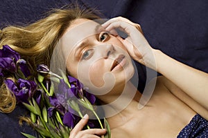 Attractive girl with flowers iris