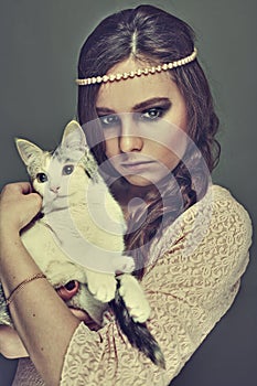 Attractive girl holding a cat