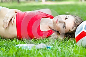 Attractive girl lay on grass