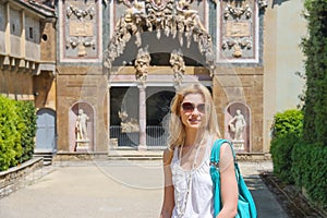 Attractive girl near the grotto Buontalenti in the Boboli garden