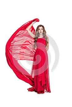 attractive girl posing in red chiffon dress with veil