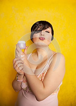 Attractive girl putting anti-aging cream on her palm arm