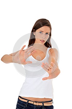 Attractive girl with repelling gesture