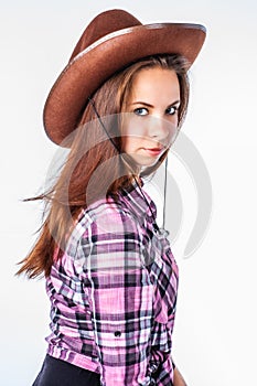 Attractive girl with straight long hair in cowboy hat