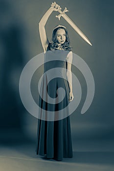 Attractive girl who raised her sword above herself. Halloween se
