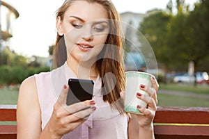 Attractive girl writing sms