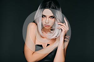 Attractive glamor girl posing in grey wig, isolated