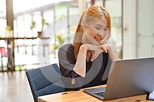 Attractive and gorgeous asian woman remote working at the coffee shop