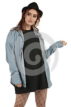 Attractive grunge, rock punk girl in a long oversized black t-shirt dress with a blank space ready for your design