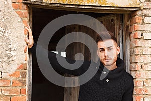 Attractive guy in a old house