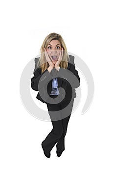 Attractive and happy businesswoman posing excited smiling surprised in shock