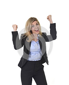 Attractive happy businesswoman posing gesturing with fist excited in business success