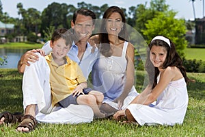 Attractive Happy Family Sitting Outside