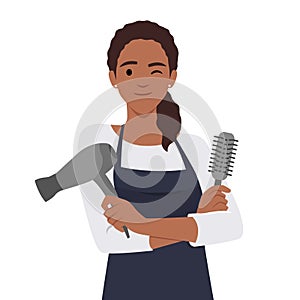 Attractive happy girl hairdresser with comb and hair dryer portrait
