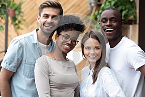 Attractive happy multiracial people posing looking at camera